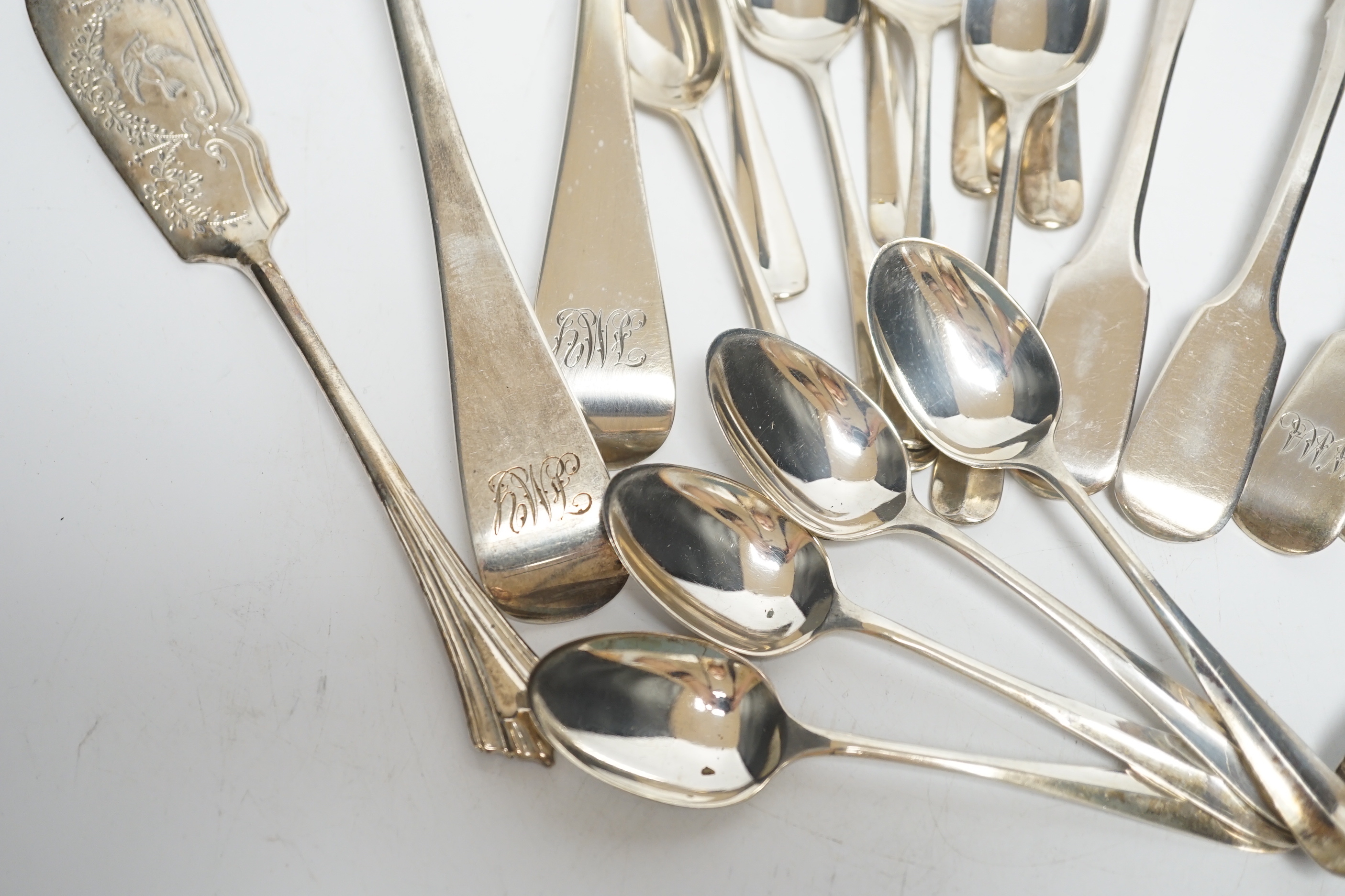 Assorted silver flatware, including teaspoons, various dates and makers, a pair of late Victorian silver Old English pattern sauce ladles, London, 1895 and a George III silver Old English pattern stilton scoop